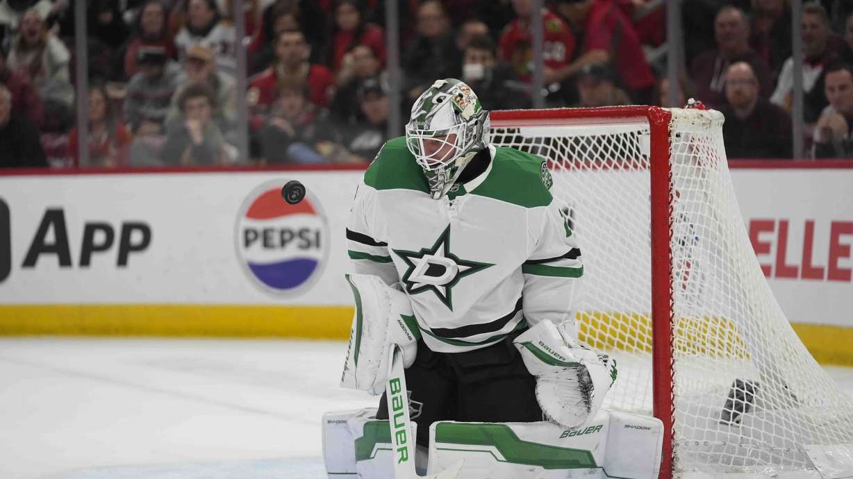 Dallas Stars goaltender Jake Oettinger makes a save on the Chicago Blackhawks during the second period of an NHL hockey game Sunday, Dec. 29, 2024, in Chicago.