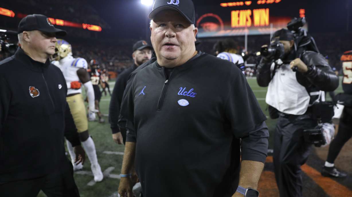 FILE - UCLA coach Chip Kelly walks off the field following the team's NCAA college football game against Oregon State, Oct. 14, 2023, in Corvallis, Ore.