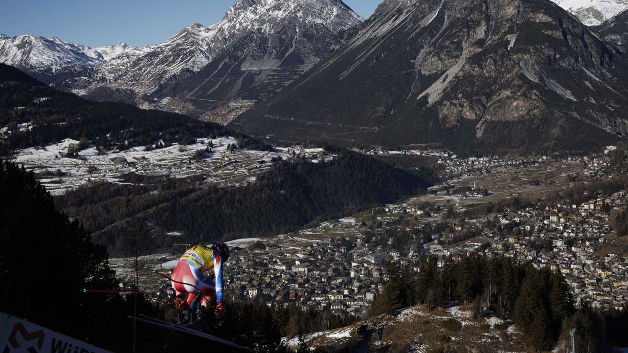 France's Cyprien Sarrazin is airborn during an alpine ski, men's World Cup downhill training, in Bormio, Italy, Friday, Dec. 27, 2024.