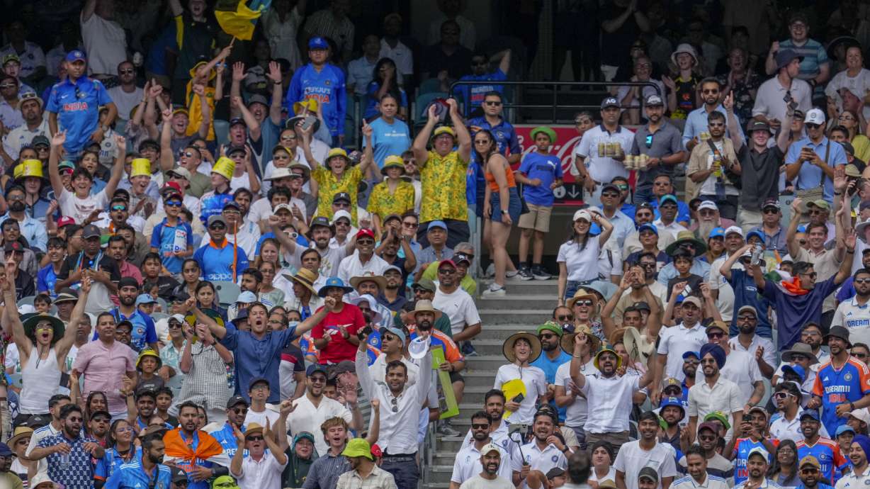 The crowd reacts after Australia's Sam Konstas hits a six during play at the Melbourne Cricket Ground, Melbourne, Australia, Dec. 26. The world population will be 8.09 billion people on New Year's Day, the U.S. Census Bureau estimates.
