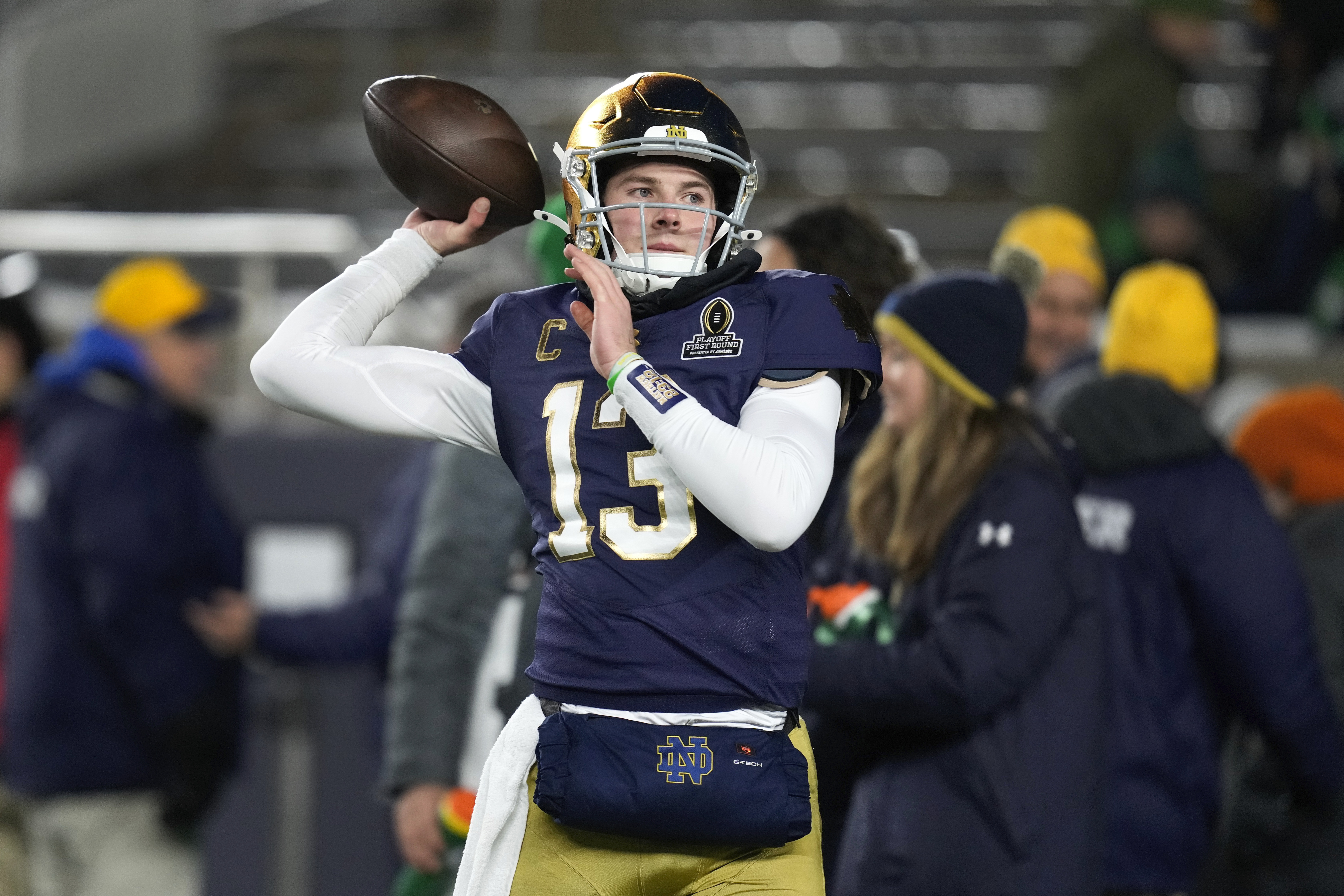 Notre Dame quarterback Riley Leonard (13) throws before the first half in the first round of the College Football Playoff against Indiana, Friday, Dec. 20, 2024, in South Bend, Ind.