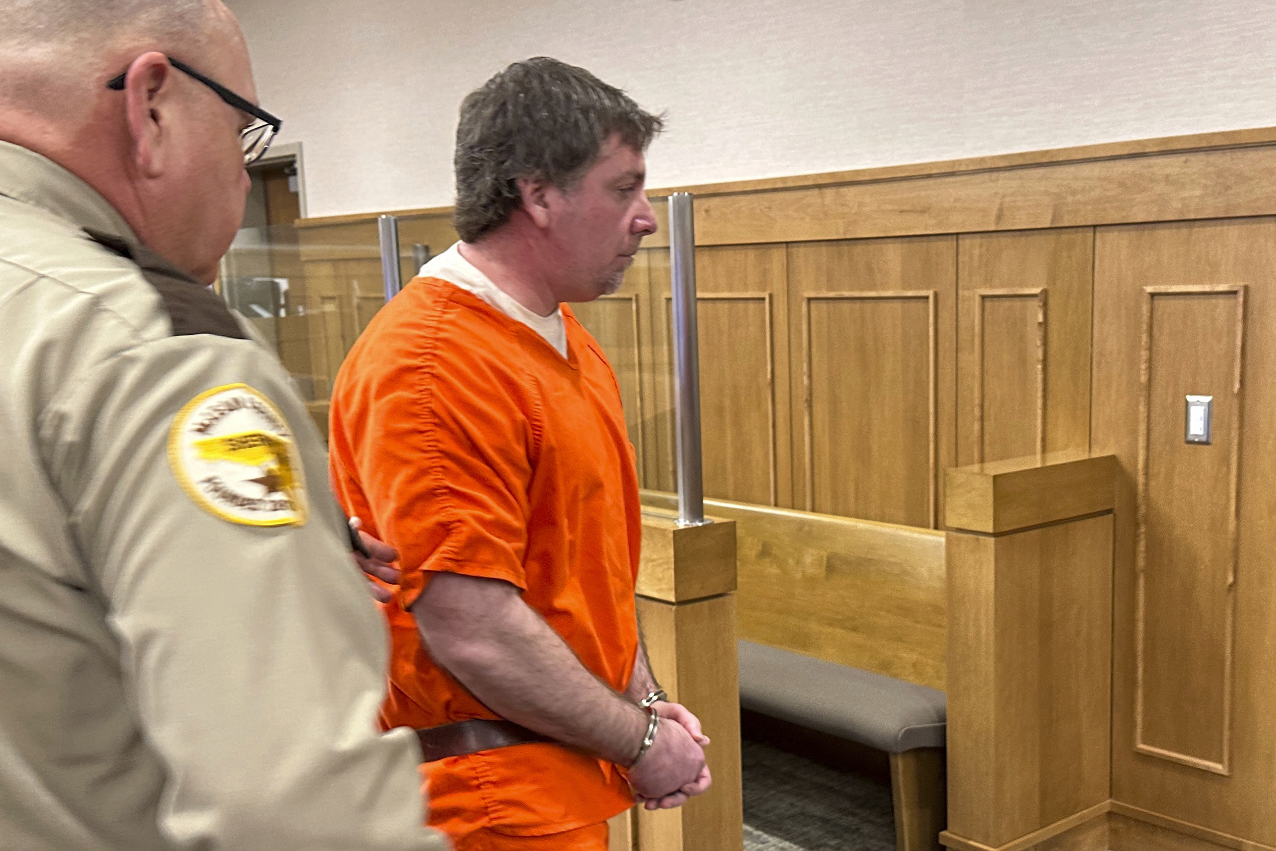 Deputies lead Ian Cramer, center, out of a courtroom at the Mercer County Courthouse in Stanton, N.D., on Monday after his sentencing. 