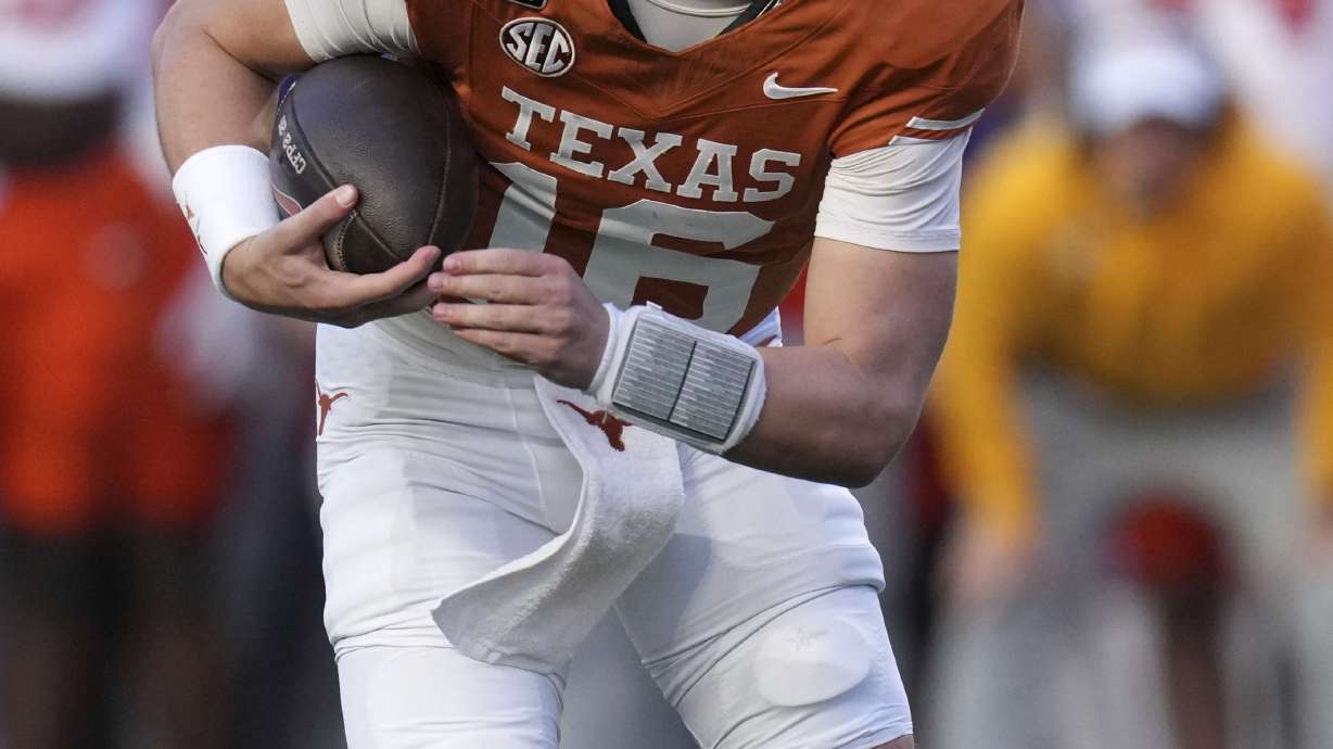 Texas quarterback Arch Manning runs up field during the second half against Clemson in the first round of the College Football Playoff, Saturday, Dec. 21, 2024, in Austin, Texas.