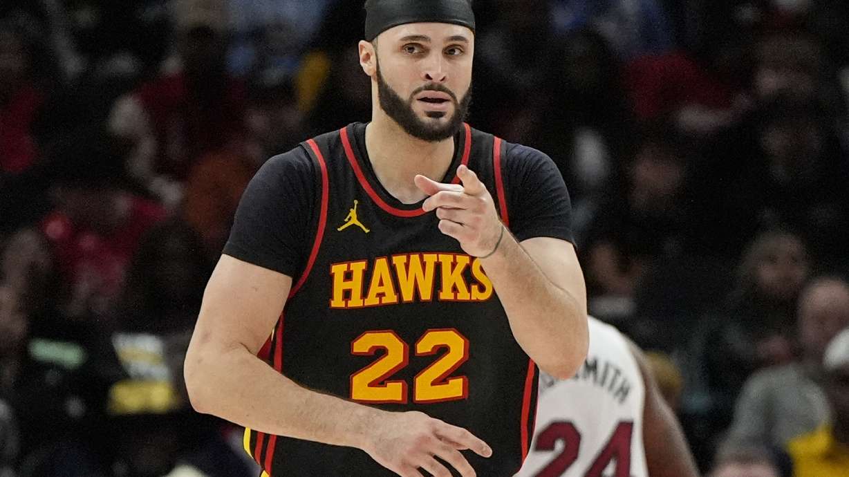 Atlanta Hawks forward Larry Nance Jr. (22) celebrates a goal against the Miami Heat during the second half of an NBA basketball game, Saturday, Dec. 28, 2024, in Atlanta.