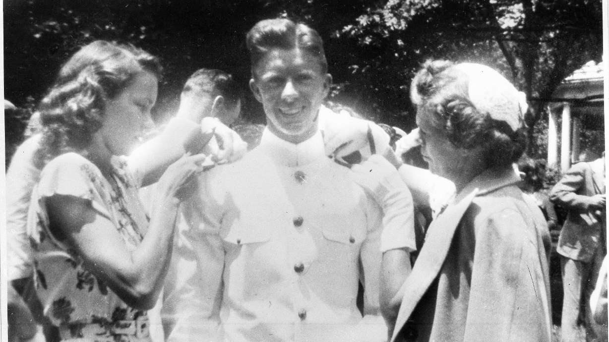Jimmy Carter gets his bars pinned on by his wife, Rosalynn Carter, left, and his mother, Lillian Carter, at the U.S. Naval Academy in this undated photo.