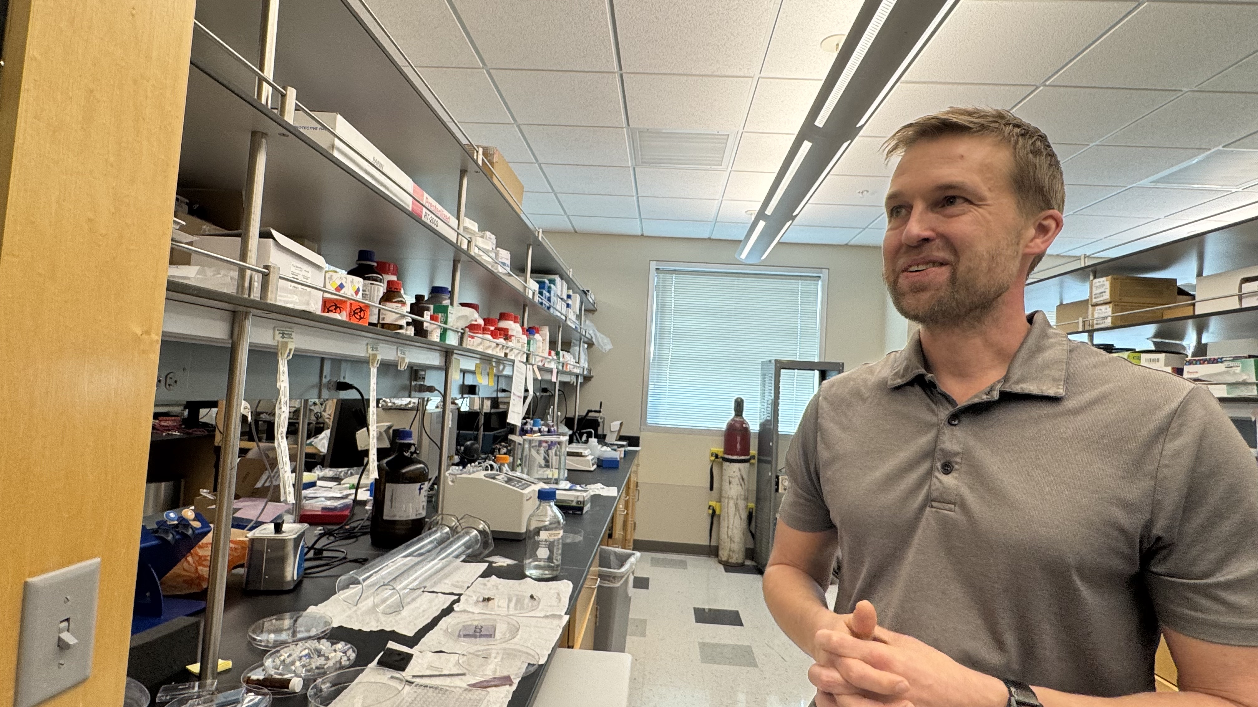 Frans Vinberg shows tools in his eye lab at the Moran Eye Center. He is part of a project aiming to make eye transplants a reality.