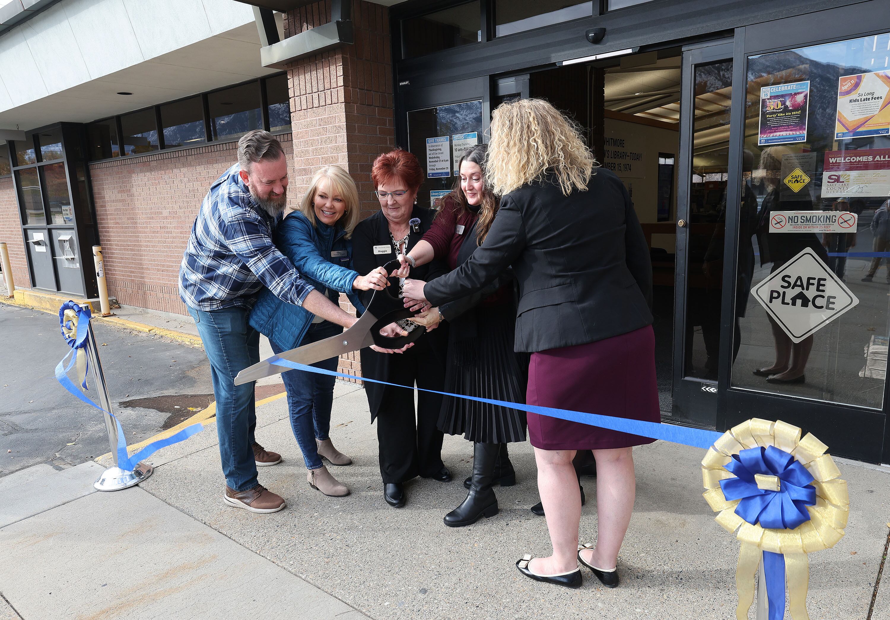 A ribbon is cut during the Whitmore library 50th year celebration in Cottonwood Heights on Nov. 15.