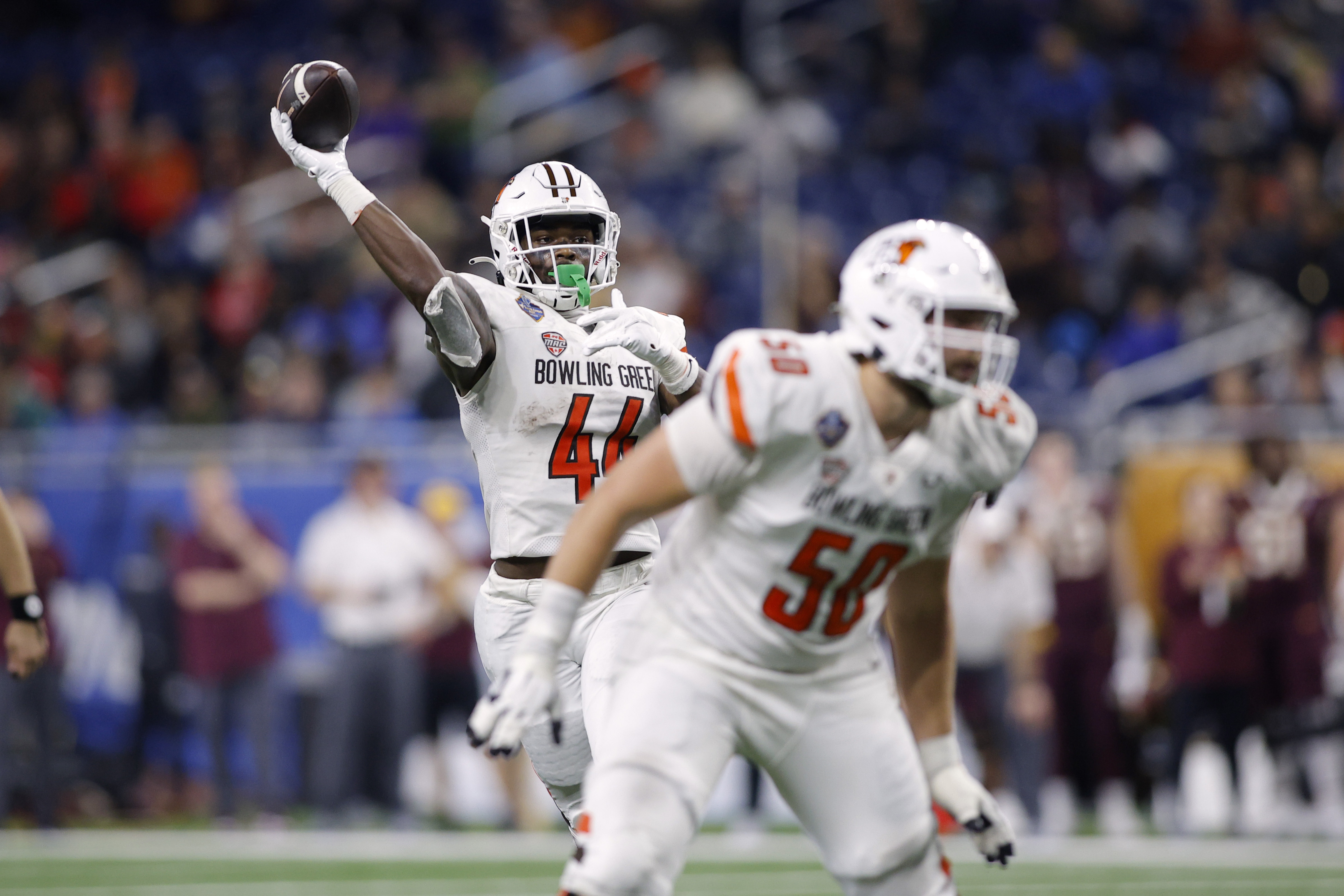 FILE - Bowling Green tight end Harold Fannin Jr. (44) throws a pass as Bowling Green offensive tackle Alex Wollschlaeger (50) looks to block against Minnesota during the Quick Lane Bowl NCAA college football game, Dec. 26, 2023, in Detroit.