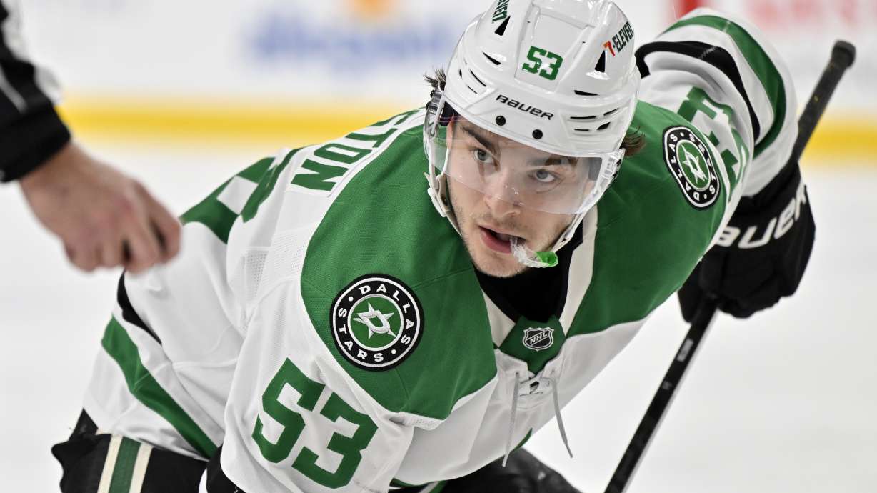 Dallas Stars center Wyatt Johnston (53) eyes the puck as he faces off against the Vegas Golden Knights during the third period of an NHL hockey game Friday, Dec. 6, 2024, in Las Vegas.