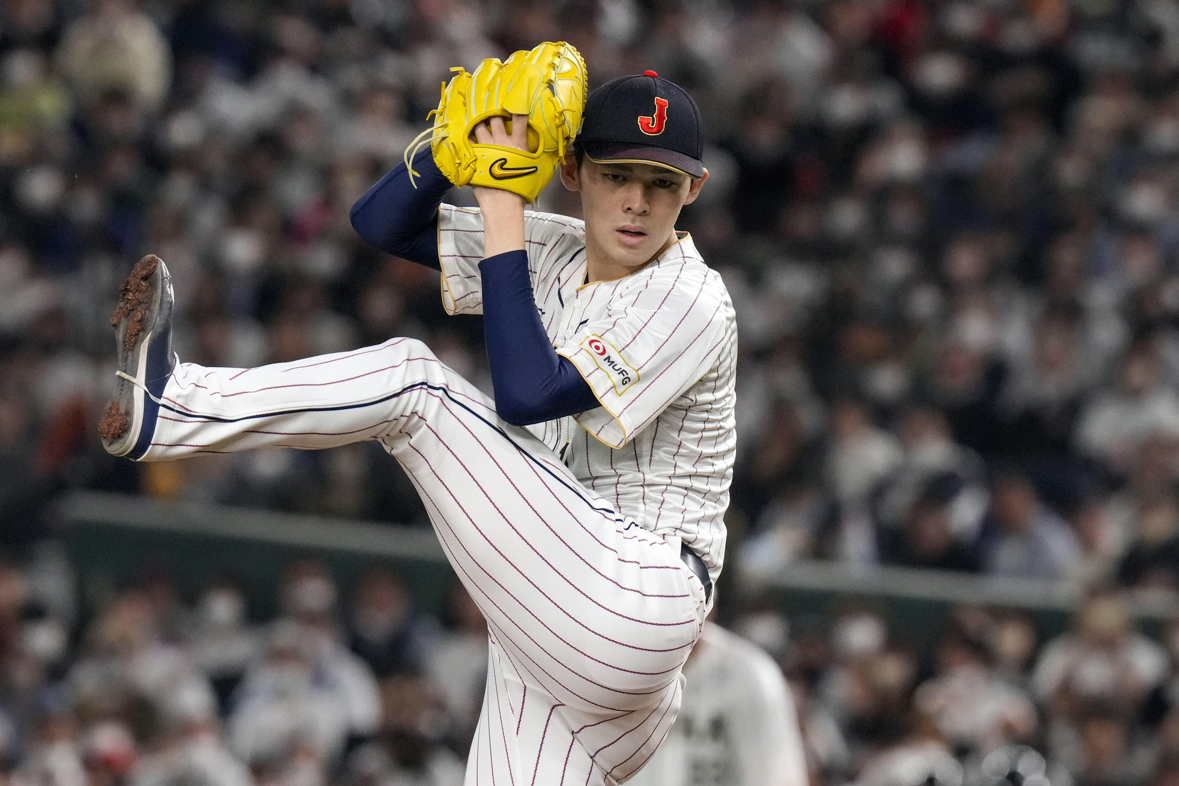 FILE - Roki Sasaki, of Japan, pitches during their Pool B game against the Czech Republic at the World Baseball Classic at the Tokyo Dome in Japan Saturday, March 11, 2023.
