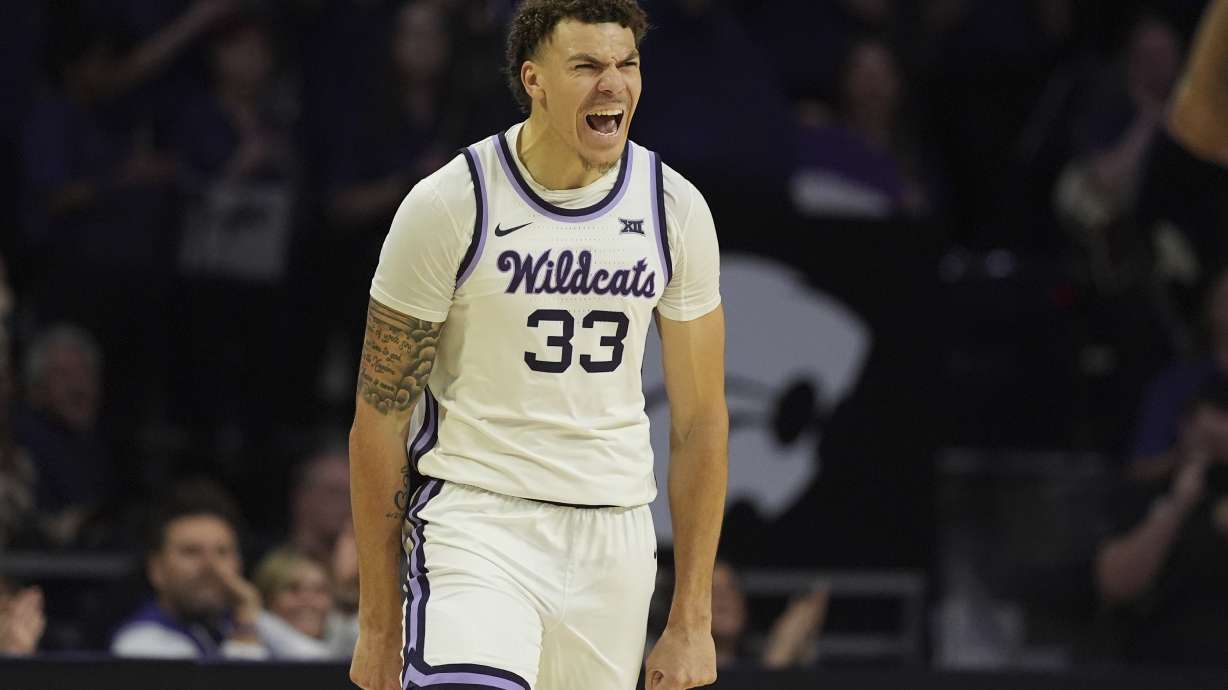 Kansas State guard Coleman Hawkins celebrates after making a basket during the first half of an NCAA college basketball game against Cincinnati, Monday, Dec. 30, 2024, in Manhattan, Kan.