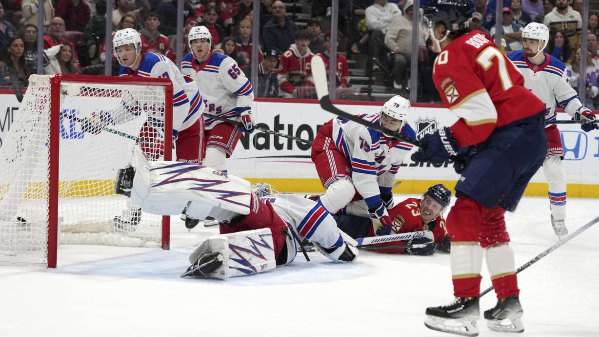 Florida Panthers center Jesper Boqvist (70) watches after scoring a goal against New York Rangers goaltender Igor Shesterkin, bottom left, during the second period of an NHL hockey game Monday, Dec. 30, 2024, in Sunrise, Fla.