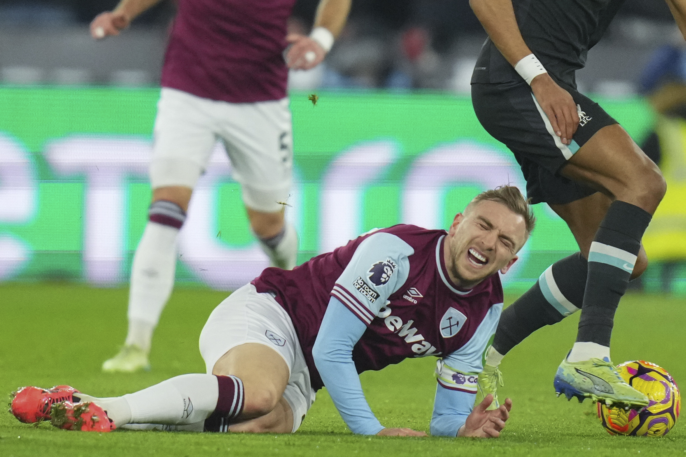 FILE - West Ham's Jarrod Bowen falls on the ground during the English Premier League soccer match between West Ham United and Liverpool at the London Stadium in London, Sunday, Dec. 29, 2024.