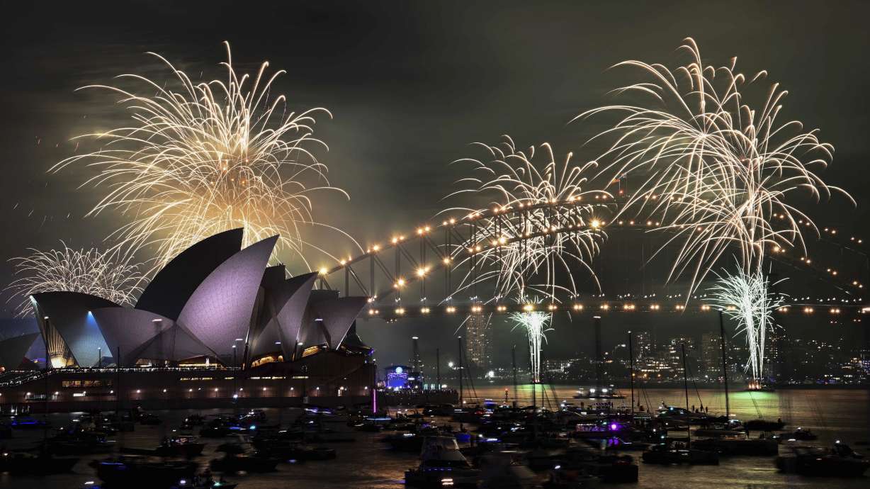 The 9pm fireworks are seen during New Year's Eve celebrations in Sydney, Australia, on Tuesday.