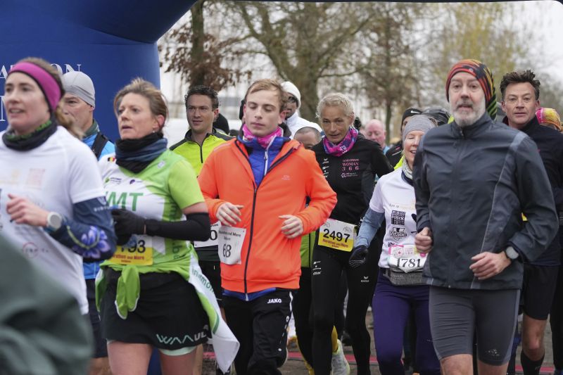 Belgian ultra runner Hilde Dosogne, center, runs with the pack during her 366th consecutive marathon in Ghent, Belgium, Tuesday.