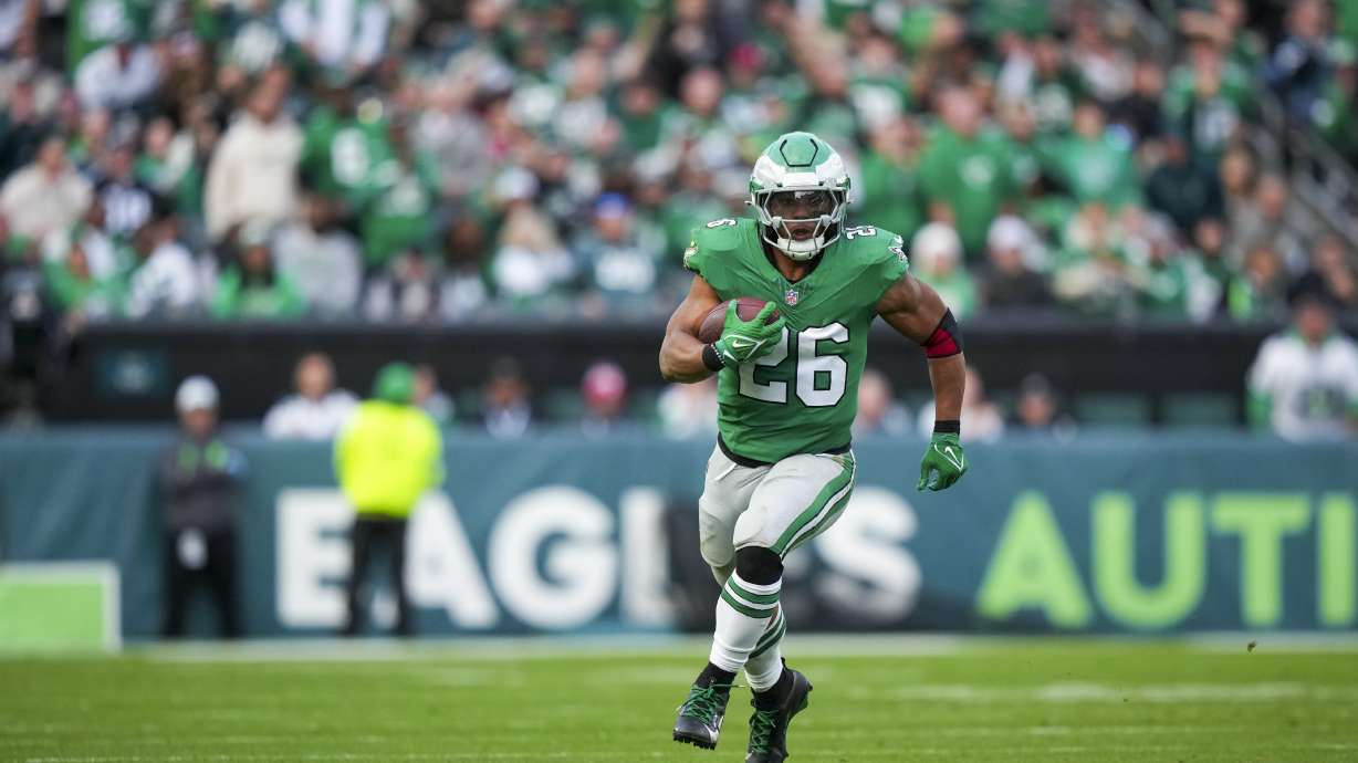 Philadelphia Eagles running back Saquon Barkley (26) runs the ball against the Dallas Cowboys during the second half of an NFL football game, Sunday, Dec. 29, 2024, in Philadelphia.