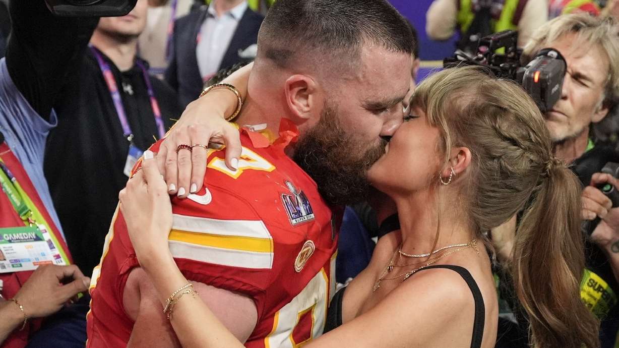 Kansas City Chiefs tight end Travis Kelce (87) kisses Taylor Swift after the NFL Super Bowl 58 football game against the San Francisco 49ers, Sunday, Feb. 11, 2024, in Las Vegas. The Chiefs won 25-22.