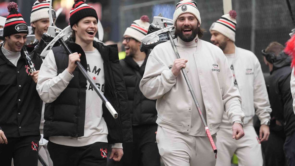 Chicago Blackhawks left wing Lukas Reichel, left, and left wing Patrick Maroon arrive with the team for the NHL Winter Classic outdoor hockey game featuring the Blackhawks and St. Louis Blues at Wrigley Field, Tuesday, Dec. 31, 2024, in Chicago.