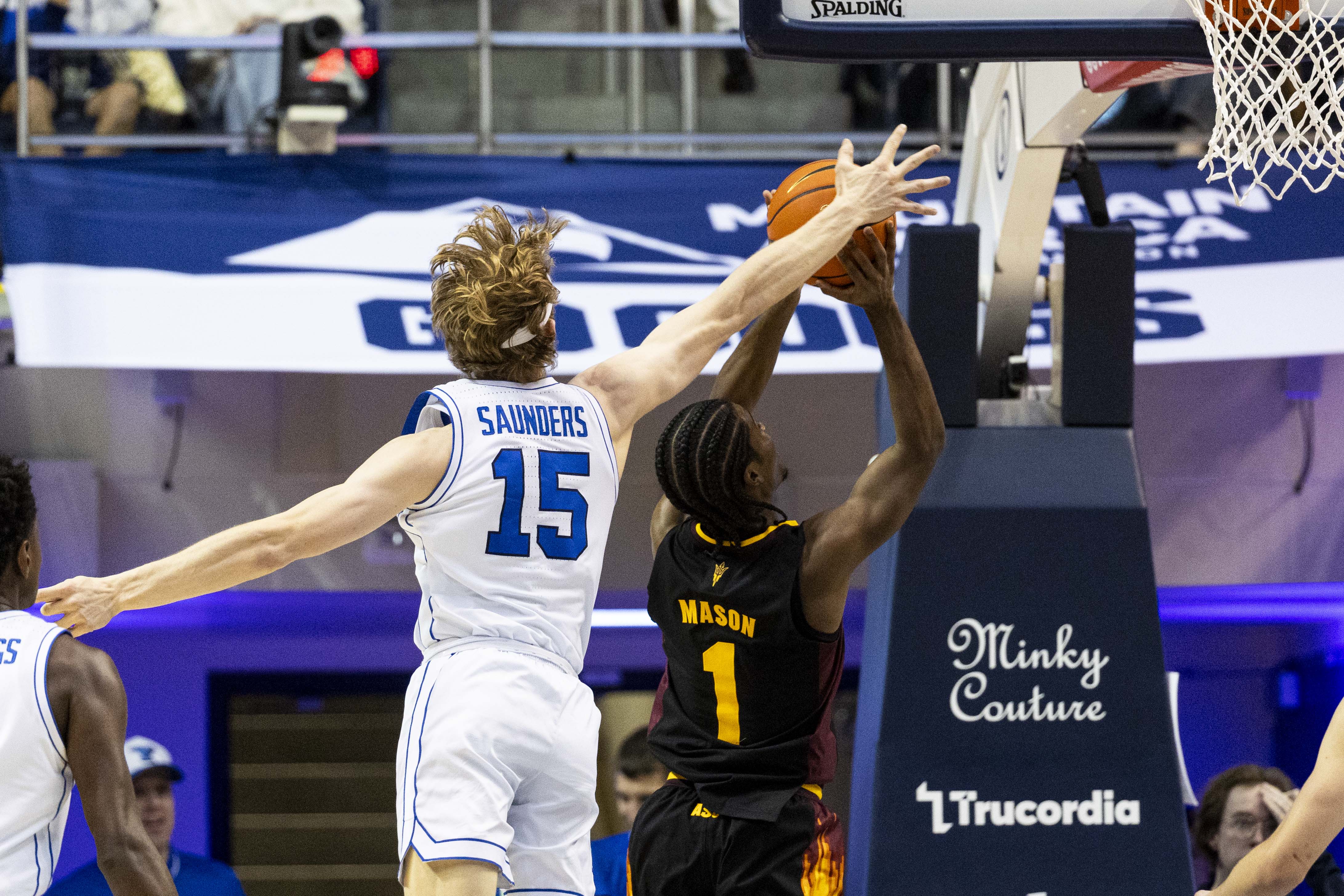 BYU forward Richie Saunders (15) blocks a shot from Arizona State guard Alston Mason (1) during an NCAA men’s basketball game held at the Marriott Center in Provo on Tuesday, Dec. 31, 2024.