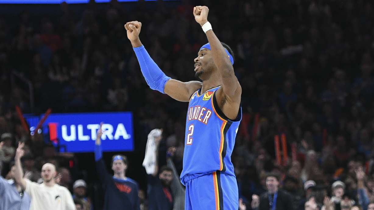 Oklahoma City Thunder guard Shai Gilgeous-Alexander celebrates after a basket during the first half of an NBA basketball game against the Minnesota Timberwolves, Tuesday, Dec. 31, 2024, in Oklahoma City.