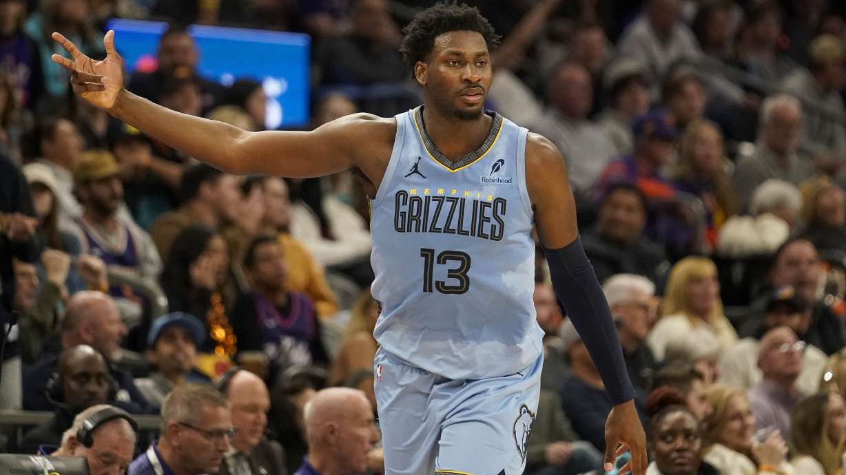 Memphis Grizzlies forward Jaren Jackson Jr. (13) celebrates hitting a 3-pointer during the second half of an NBA basketball game against the Phoenix Suns Tuesday, Dec. 31, 2024, in Phoenix. Memphis won 117-112.