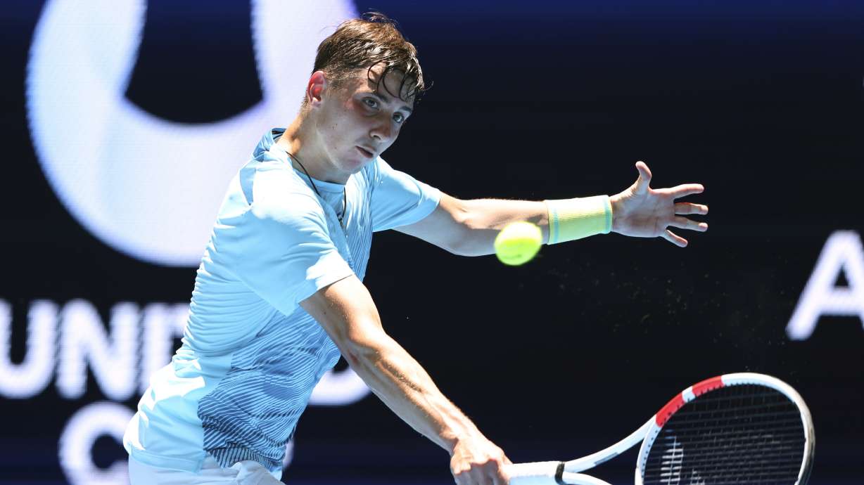 Alexander Shevchenko of Kazakhstan hits a return shot to Daniel Masur of Germany during their United Cup tennis match in Perth, Australia, Wednesday, Jan. 1, 2025.