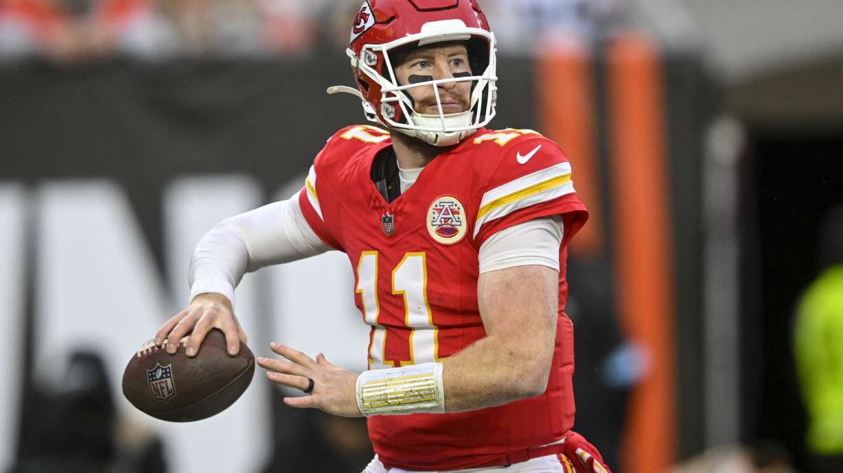 Kansas City Chiefs quarterback Carson Wentz (11) passes in the pocket against the Cleveland Browns during the second half of an NFL football game, Sunday, Dec. 15, 2024, in Cleveland.