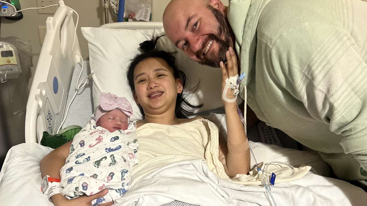 Zyani Tala Hyatt and her parents, Marygene and Bronson Hyatt, of Murray. Zyani was the first baby born at an Intermountain Health hospital in 2025.