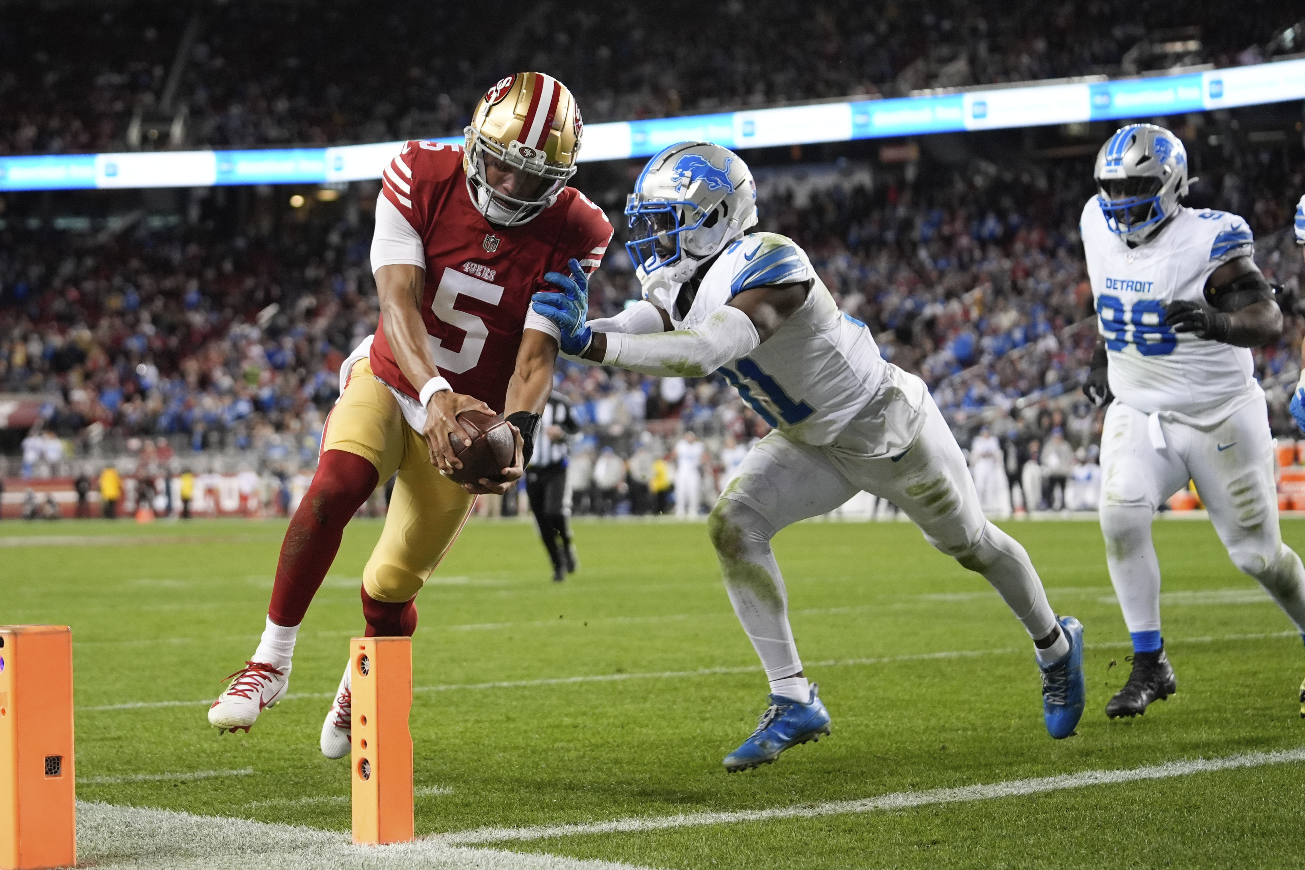 San Francisco 49ers quarterback Joshua Dobbs (5) scores a touchdown during the second half of an NFL football game against the Detroit Lions, Monday, Dec. 30, 2024, in Santa Clara, Calif.