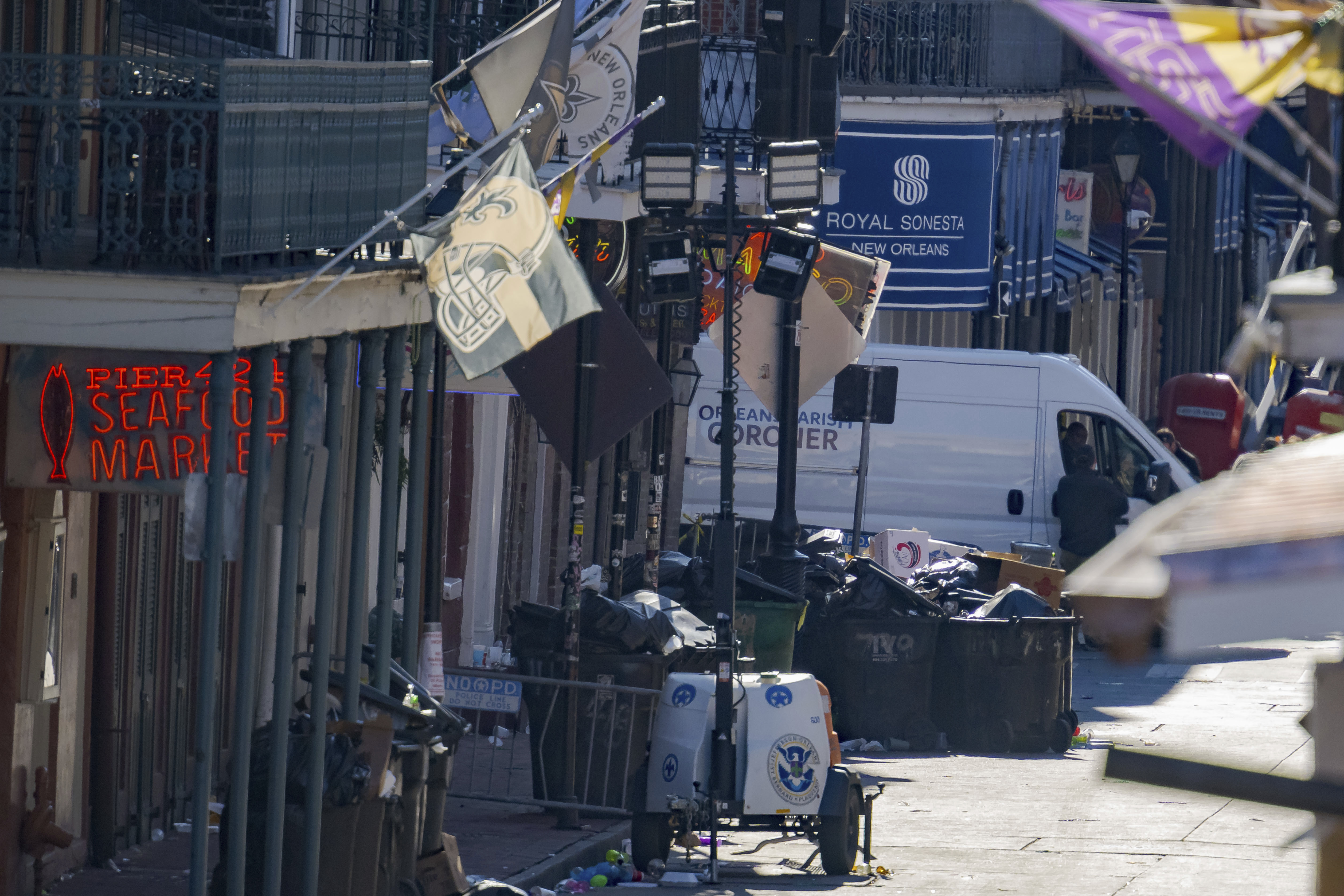 An Orleans Parish Coroner van is seen on Bourbon Street during the investigation of a pickup truck crashing into pedestrians on Bourbon Street in front of the Royal Sonesta Hotel in the French Quarter in New Orleans on Wednesday.