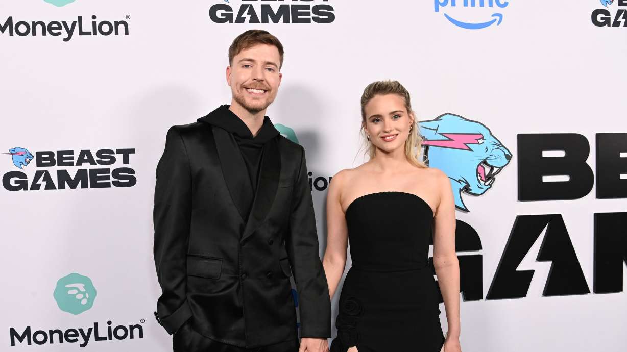 MrBeast and Thea Booysen attend a content creator special screening in Santa Monica, Calif., on Dec. 18, 2024. The couple is now engaged to be married.