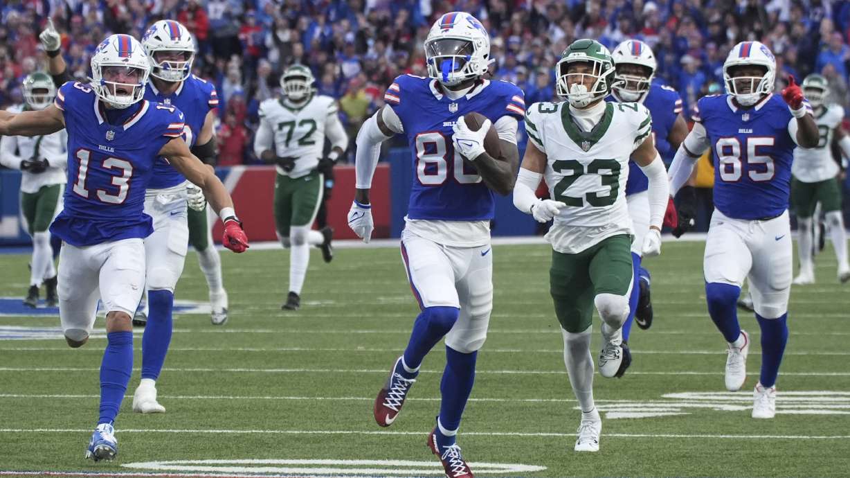 Buffalo Bills wide receiver Tyrell Shavers (80) scores a touchdown against the New York Jets on a catch a run during the second half of an NFL football game, Sunday, Dec. 29, 2024, in Orchard Park, N.Y.