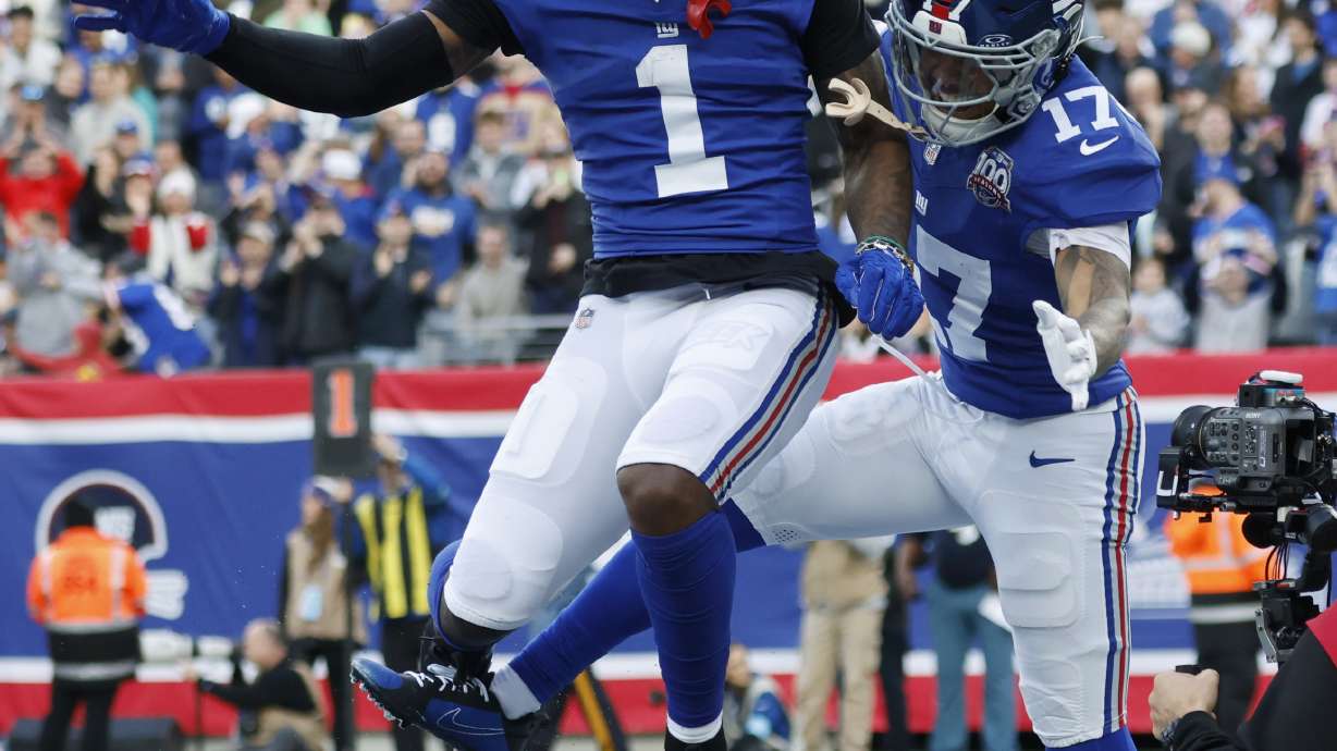 New York Giants wide receiver Wan'Dale Robinson (17) celebrates with Malik Nabers (1) after Robinson scored a touchdown against the Indianapolis Colts in the first half of an NFL football game Sunday, Dec. 29, 2024, in East Rutherford, N.J.