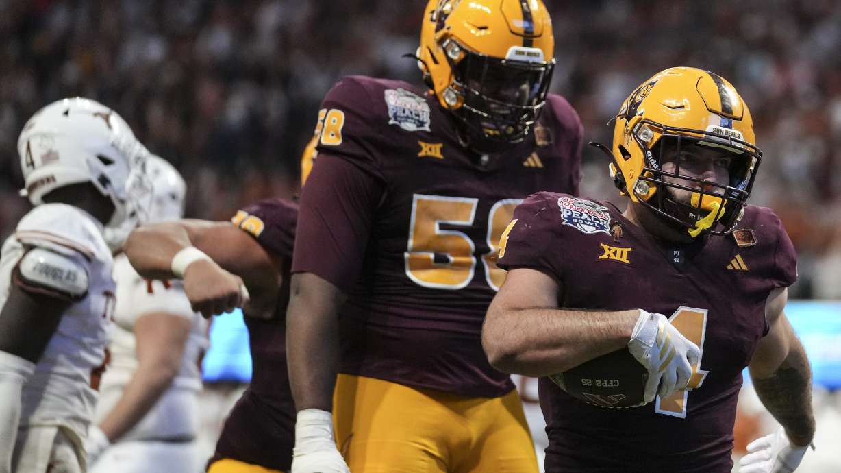 Arizona State running back Cam Skattebo (4) runs into the end zone for a touchdown against Texas during the second half in the quarterfinals of a College Football Playoff game, Wednesday, Jan. 1, 2025, in Atlanta.