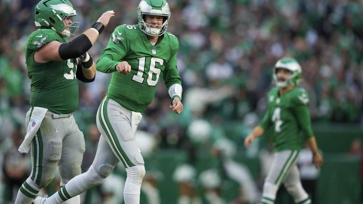Philadelphia Eagles quarterback Tanner McKee (16) reacts after throwing a touchdown pass to wide receiver DeVonta Smith during the second half of an NFL football game against the Dallas Cowboys, Sunday, Dec. 29, 2024, in Philadelphia.