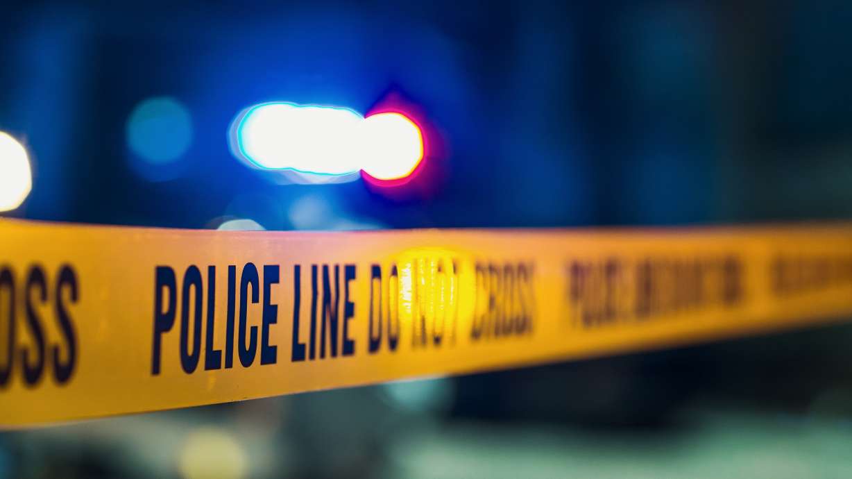 File photo shows crime scene tape. An 18-year-old man is accused of firing multiple rounds at a group of people in Salt Lake City, injuring one, during an argument that allegedly began over loud music.