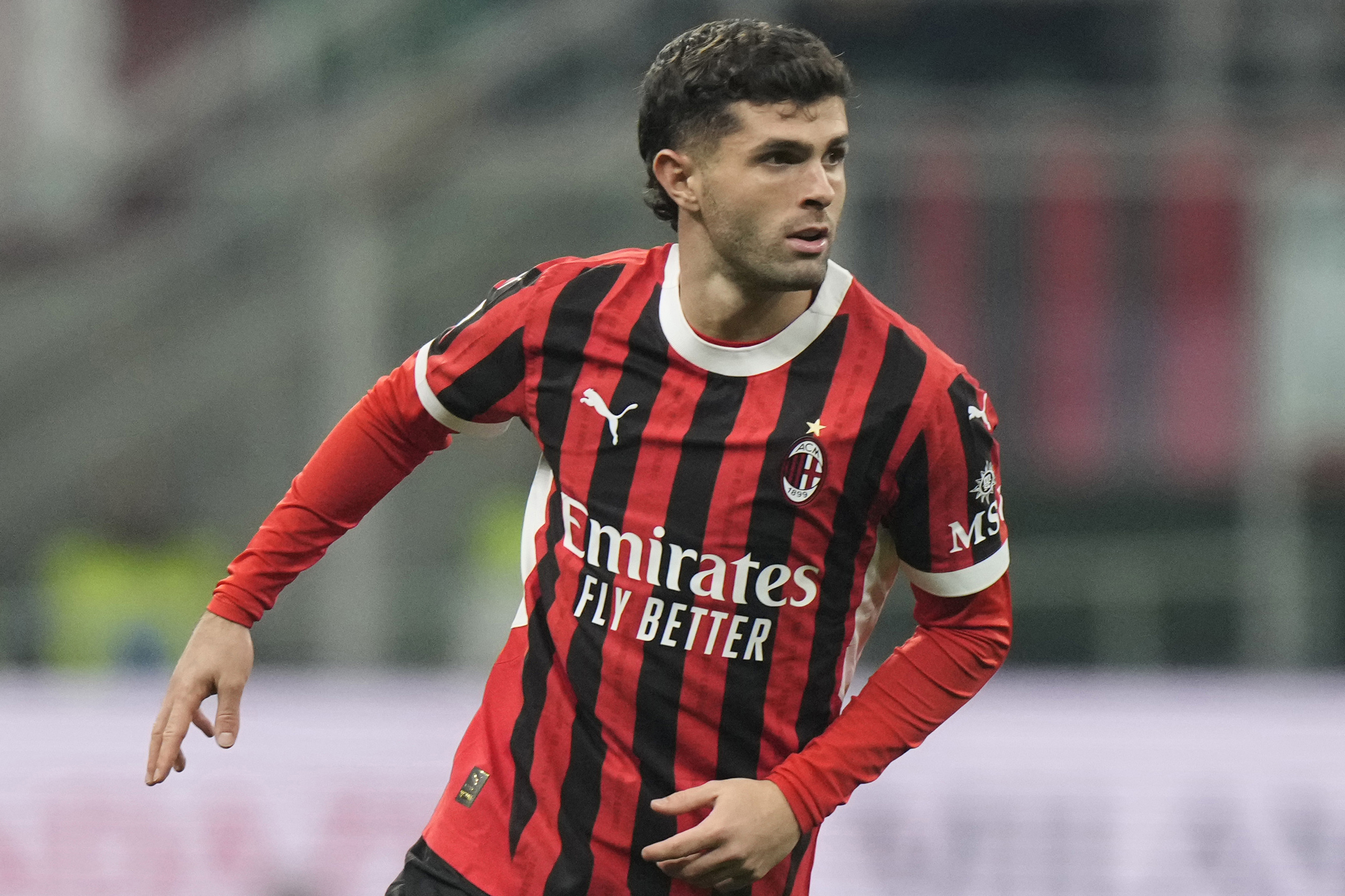 FILE - AC Milan's Christian Pulisic plays during an Italian Cup eight final soccer match between AC Milan and Sassuolo at the San Siro stadium in Milan, Italy, Wednesday, Dec. 3, 2024.