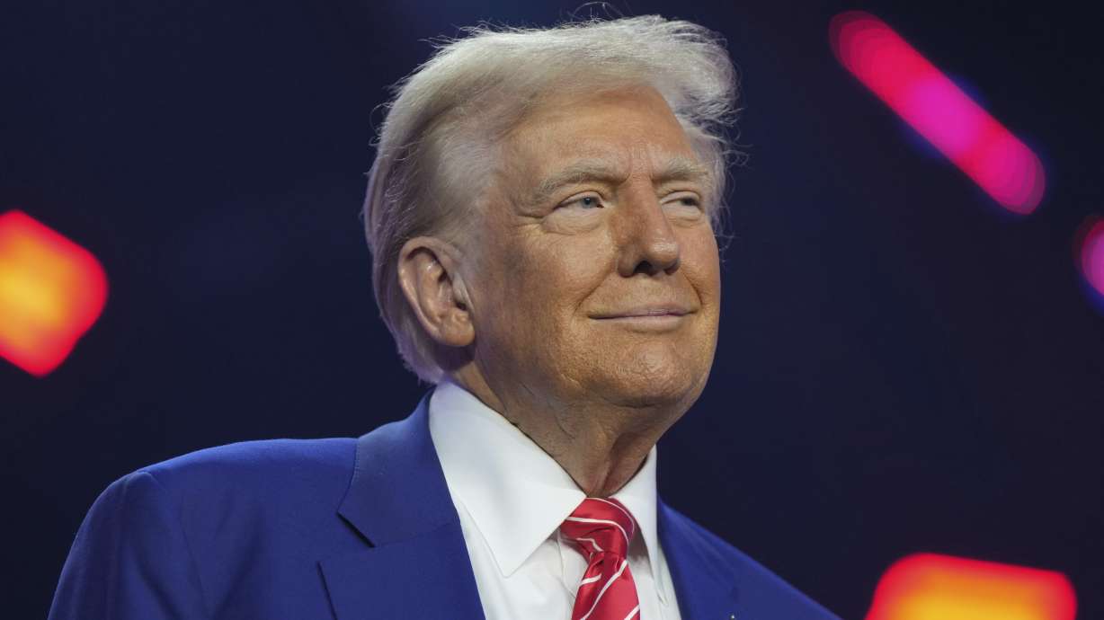 President-elect Donald Trump speaks at AmericaFest, Dec. 22, 2024, in Phoenix. A majority of Americans think President-elect Donald Trump's second administration will control illegal immigration, reduce unemployment, boost the economy and keep the U.S. out of war, a new poll says.