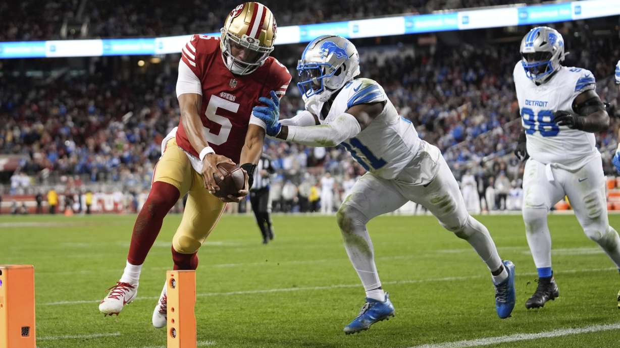 San Francisco 49ers quarterback Joshua Dobbs (5) scores a touchdown during the second half of an NFL football game against the Detroit Lions, Monday, Dec. 30, 2024, in Santa Clara, Calif.