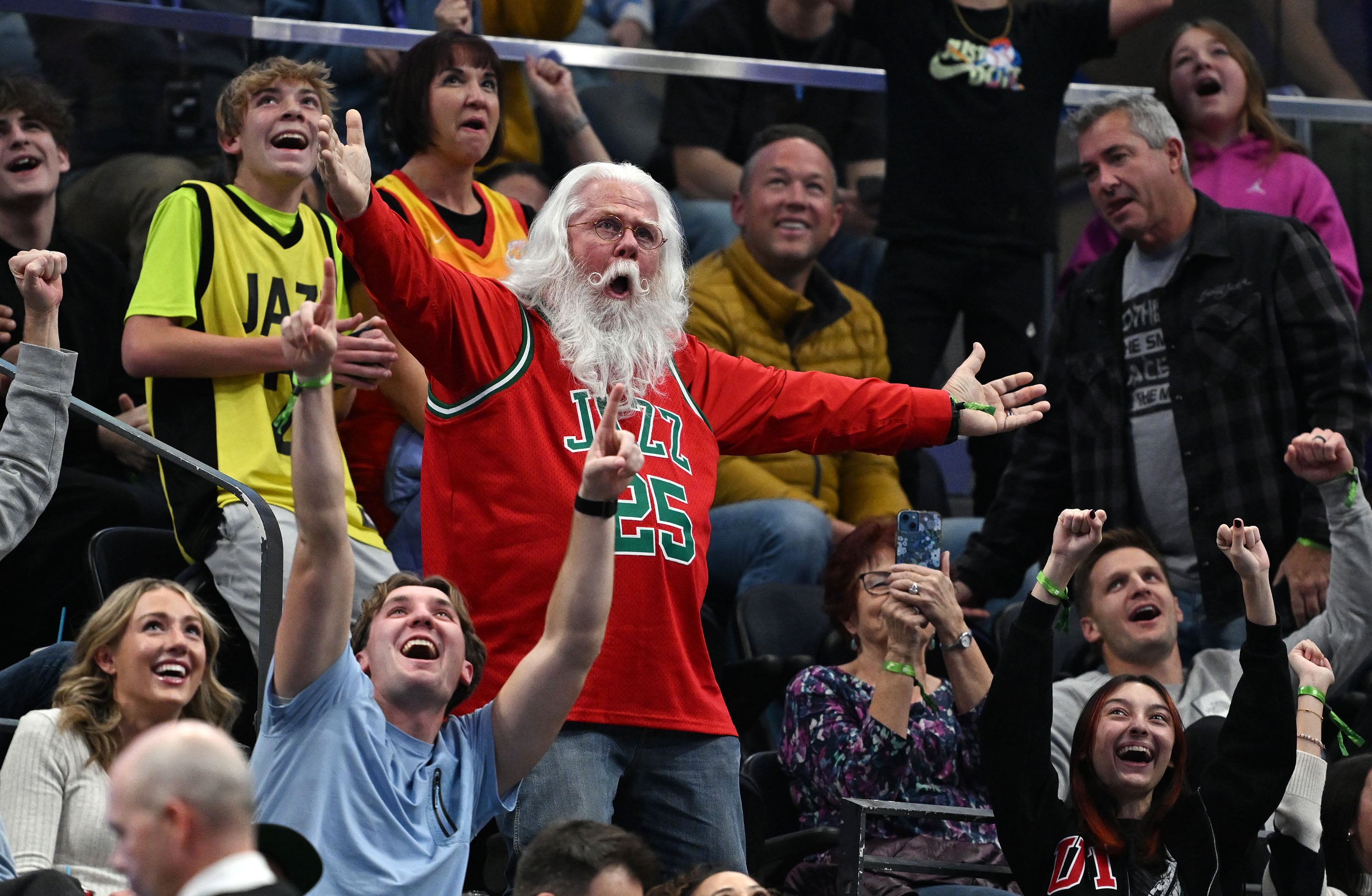 A Utah Jazz fan resembling Santa wins $250 in a dance contest as the Jazz and the Nuggets play at the Delta Center in Salt Lake City on Nov. 27. Denver won 122-103.