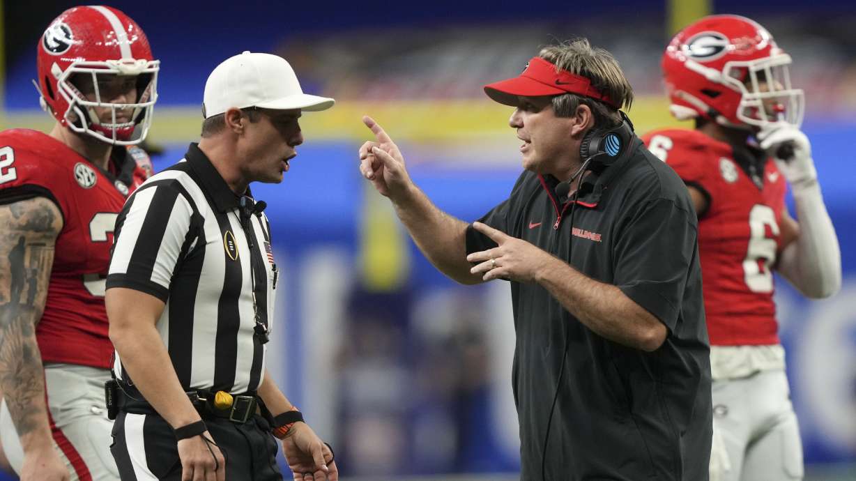 Georgia head coach Kirby Smart, right, questions a call during the second half against Notre Dame in the quarterfinals of a College Football Playoff, Thursday, Jan. 2, 2025, in New Orleans.
