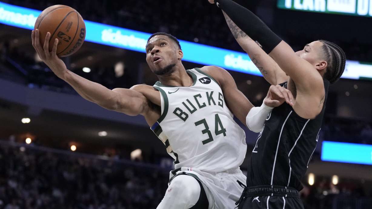 Milwaukee Bucks' Giannis Antetokounmpo shoots past Brooklyn Nets' Jalen Wilson during the second half of an NBA basketball game Thursday, Jan. 2, 2025, in Milwaukee.