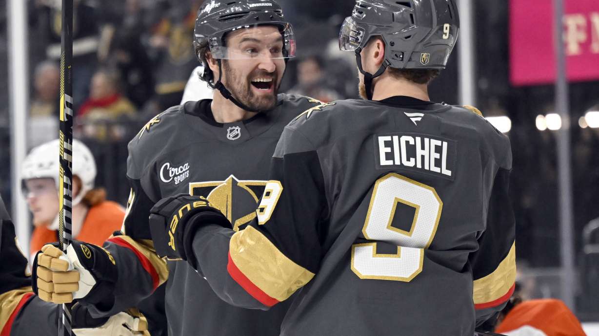 Vegas Golden Knights right wing Mark Stone, left, celebrates with center Jack Eichel (9) after scoring against the Philadelphia Flyers during the second period of an NHL hockey game Thursday, Jan. 2, 2025, in Las Vegas.