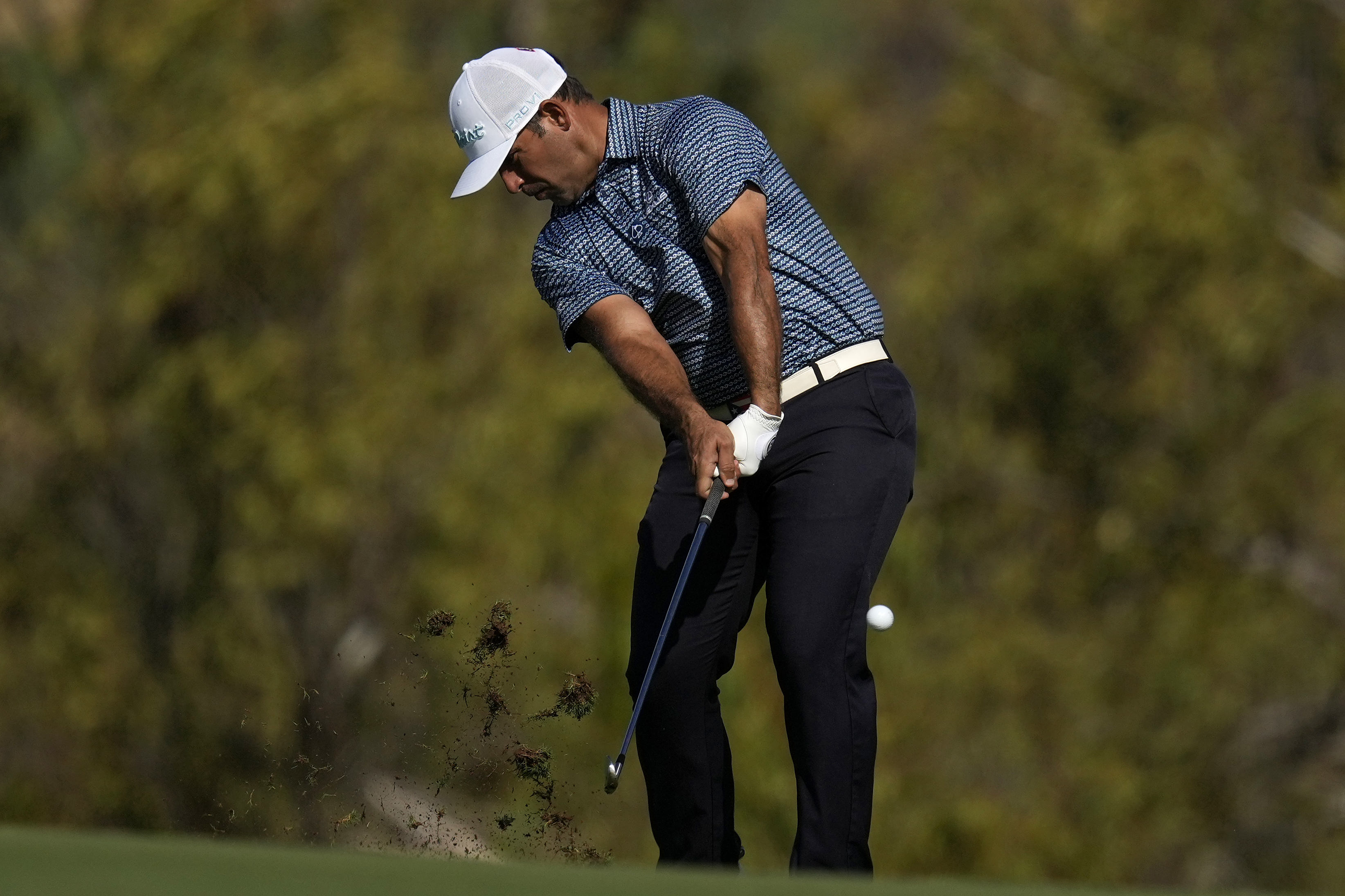 Rafael Campos, of Puerto Rico, hits from the fourth fairway during the first round of The Sentry golf event, Thursday, Jan. 2, 2025, at Kapalua Plantation Course in Kapalua, Hawaii.