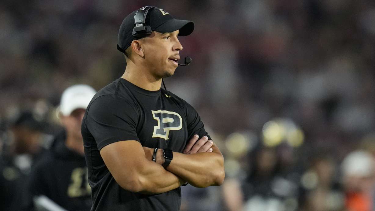FILE - Purdue head coach Ryan Walters walks on the field during the first half of an NCAA college football game against Wisconsin in West Lafayette, Ind., Friday, Sept. 22, 2023.