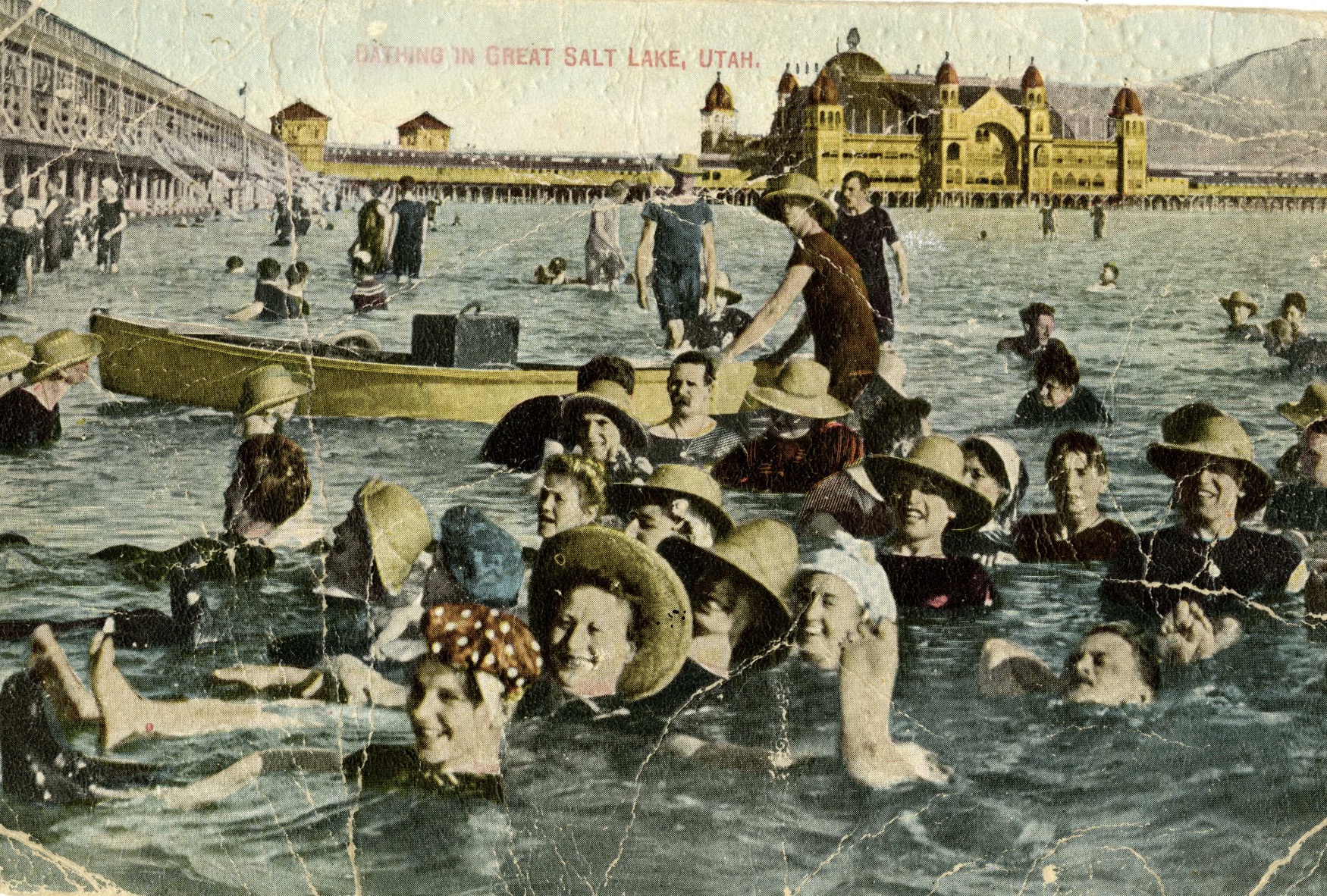 A postcard with a handcolored photograph of swimmers in Great Salt Lake and Saltair Resort in the background. It was dated July 23, 1913, around the height of the lake's visitation popularity.