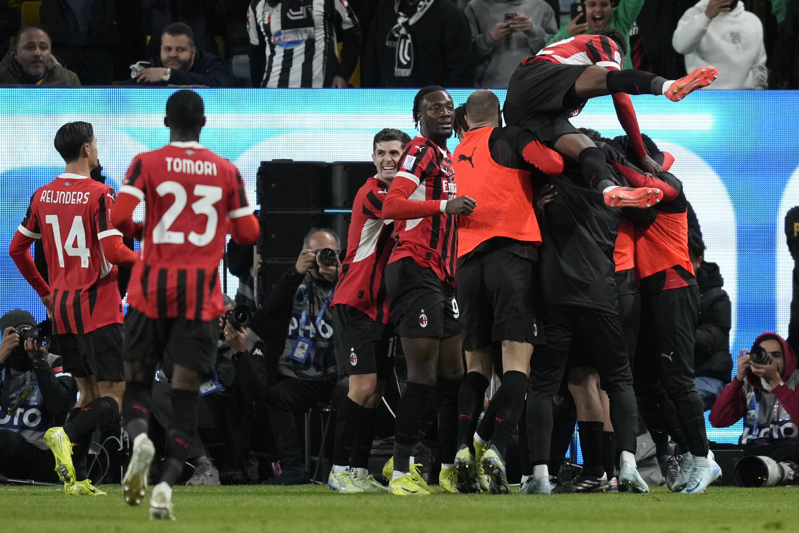 AC Milan players celebrate after scoring during the Italian Super Cup semifinal soccer match between Juventus and Milan in Riyadh, Saudi Arabia, Friday, Jan. 3, 2025.
