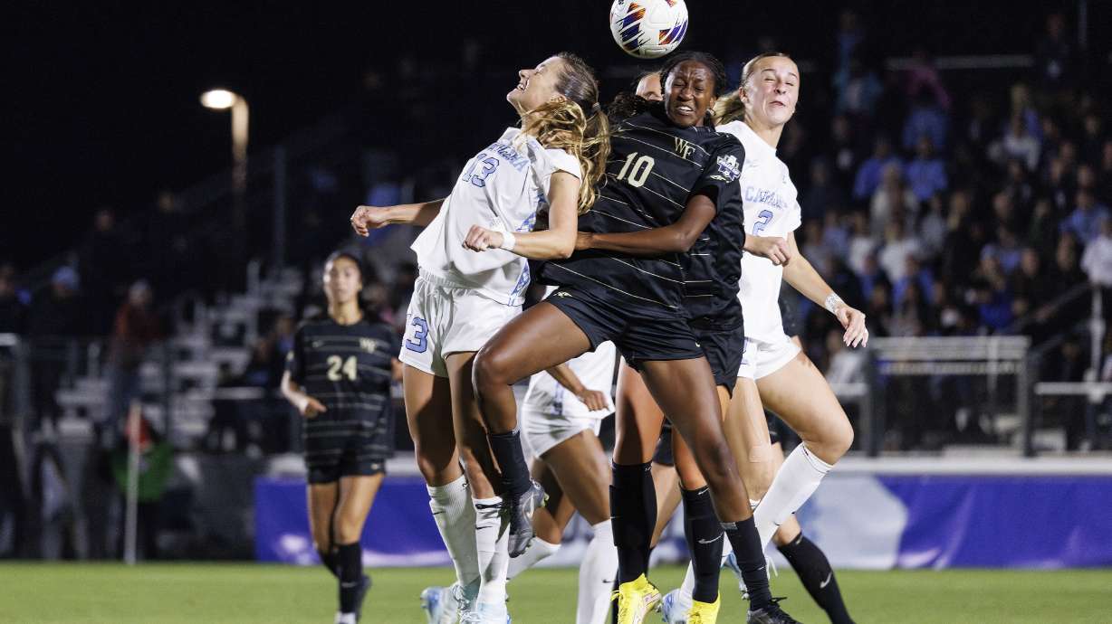 North Carolina's Kate Faasse and Wake Forest's Malaika Meena (10) battle for a ball during the second half of NCAA Women's College Cup soccer final in Cary, N.C., Monday, Dec. 9, 2024.