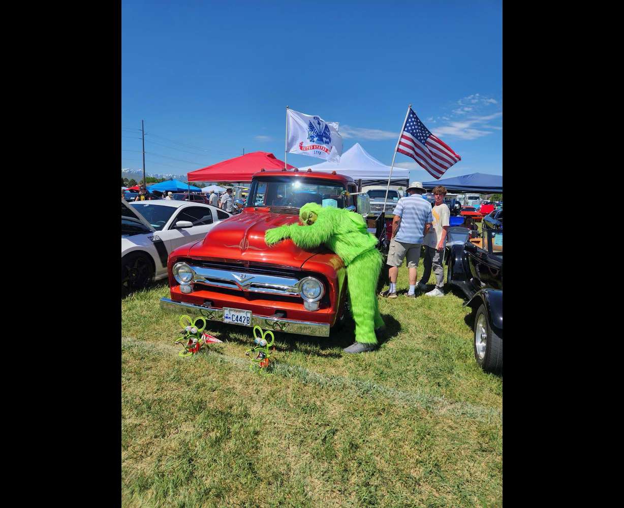Jed Jensen dressed as the Grinch at a fundraiser car show.
