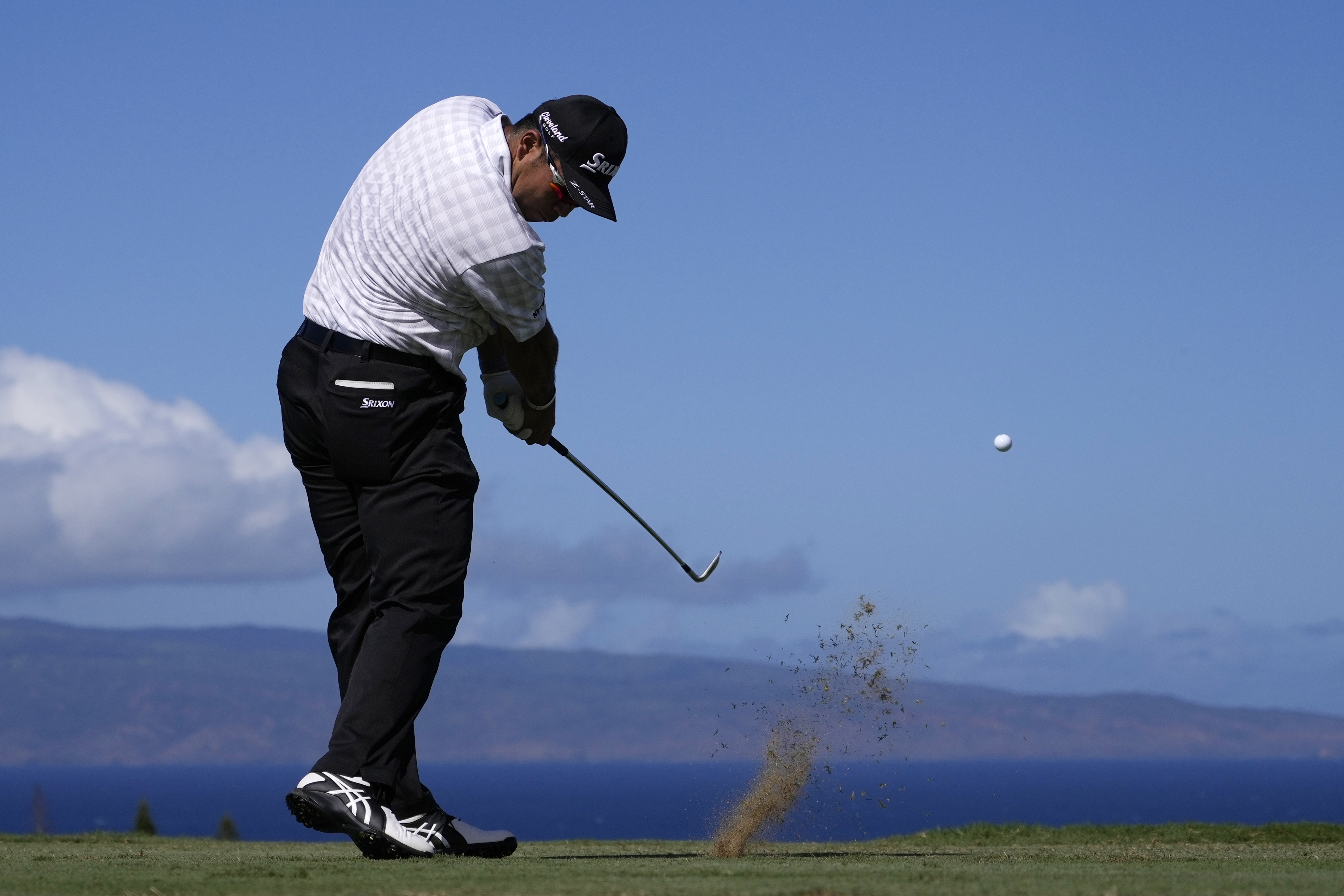 Hideki Matsuyama, of Japan, hits a shot at the 11th hole during the second round of The Sentry golf event, Friday, Jan. 3, 2025, at the Kapalua Plantation Course in Kapalua, Hawaii.